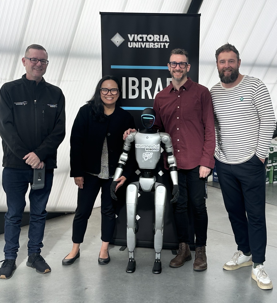 Adrian Tyson and colleagues with a humanoid robot at Victoria University
